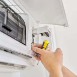 installing-an-air-conditioner-in-an-apartment-offi-2021-12-09-22-09-41-utc-min-min.jpg